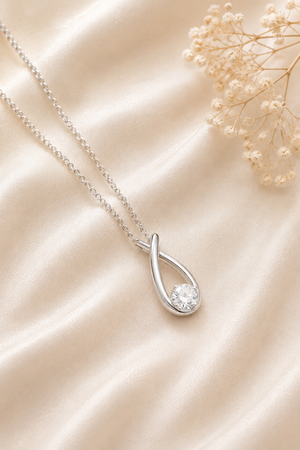 Contemporary Kiss Silver-Plated CZ Pendant Necklace
