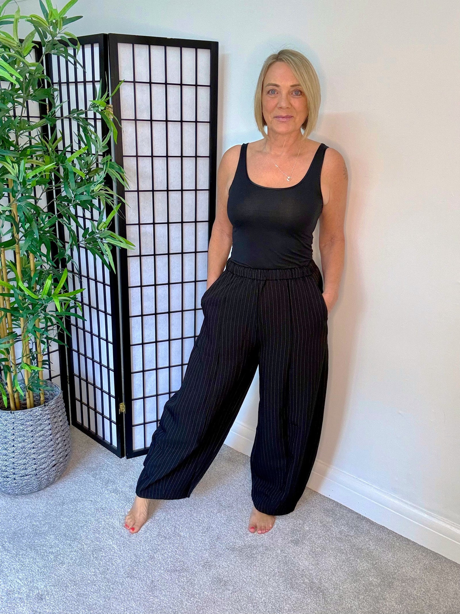 Black pinstripe barrel trousers