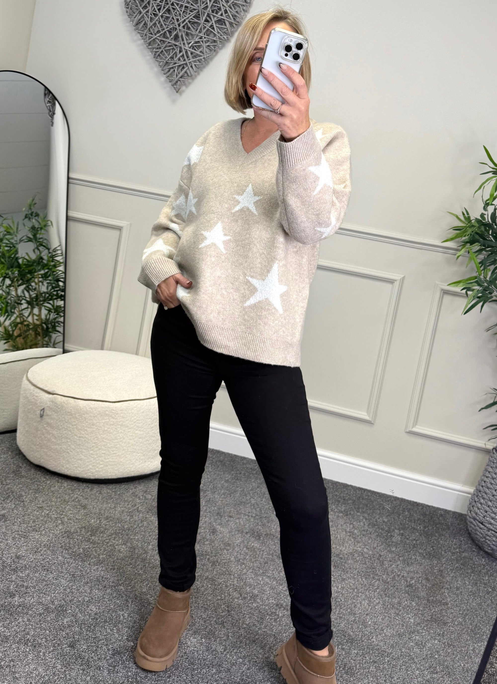 Model wearing lurex star v-neck jumper available at www.susiesboutique.co.uk