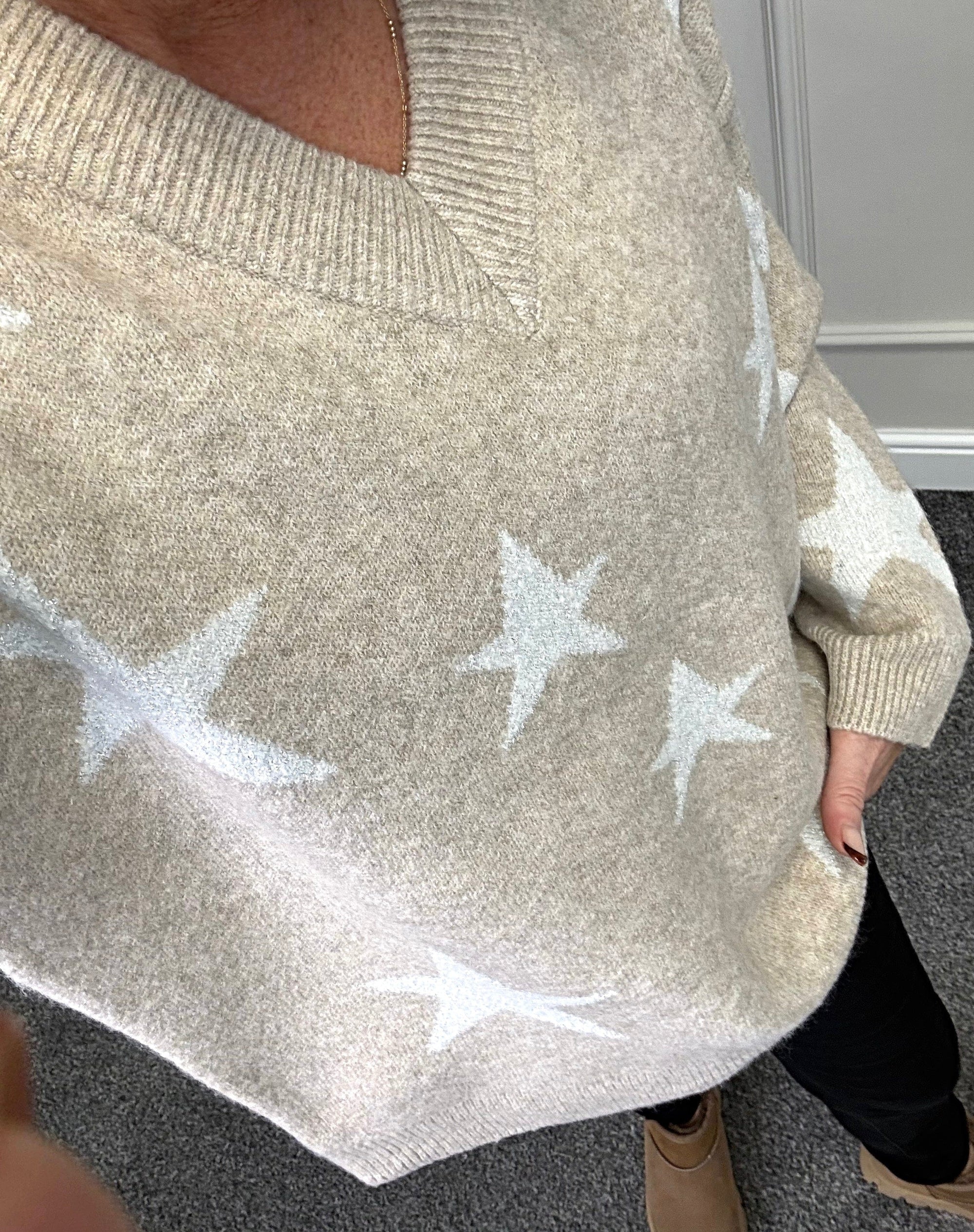 Model wearing lurex star v-neck jumper available at www.susiesboutique.co.uk