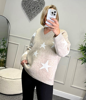 Model wearing lurex star v-neck jumper available at www.susiesboutique.co.uk