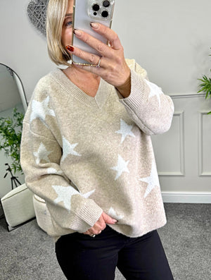 Model wearing lurex star v-neck jumper available at www.susiesboutique.co.uk