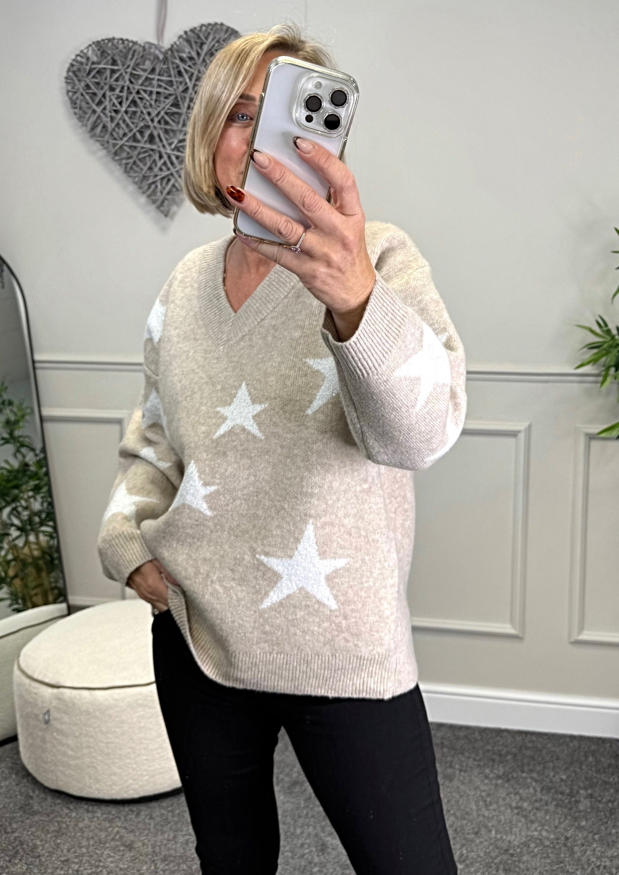 Model wearing lurex star v-neck jumper available at www.susiesboutique.co.uk