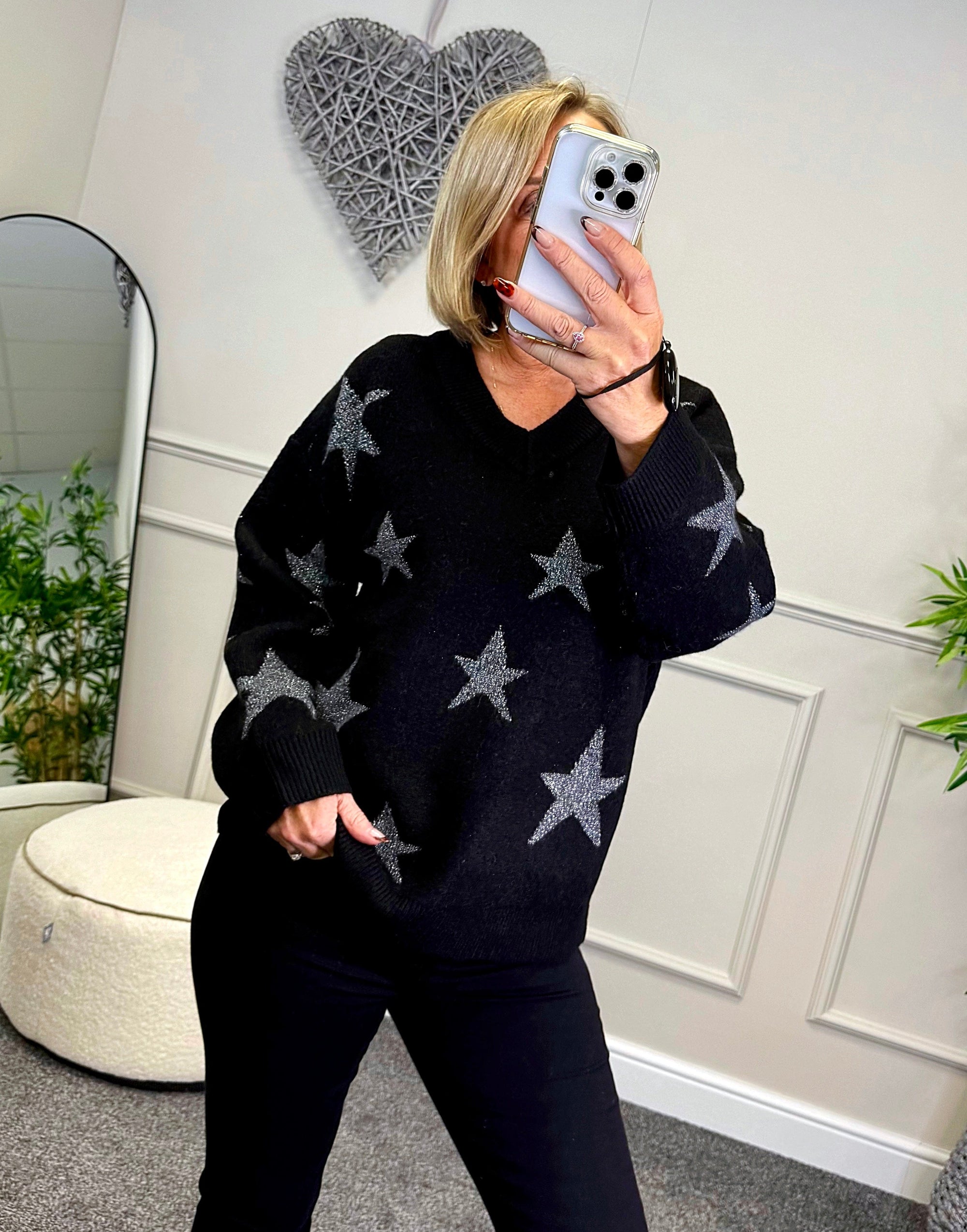 Model wearing lurex star v-neck jumper available at www.susiesboutique.co.uk