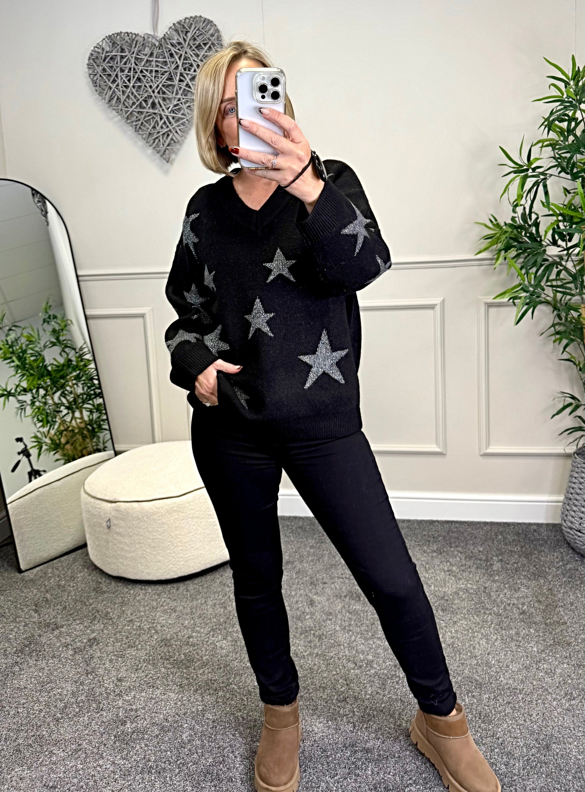 Model wearing lurex star v-neck jumper available at www.susiesboutique.co.uk