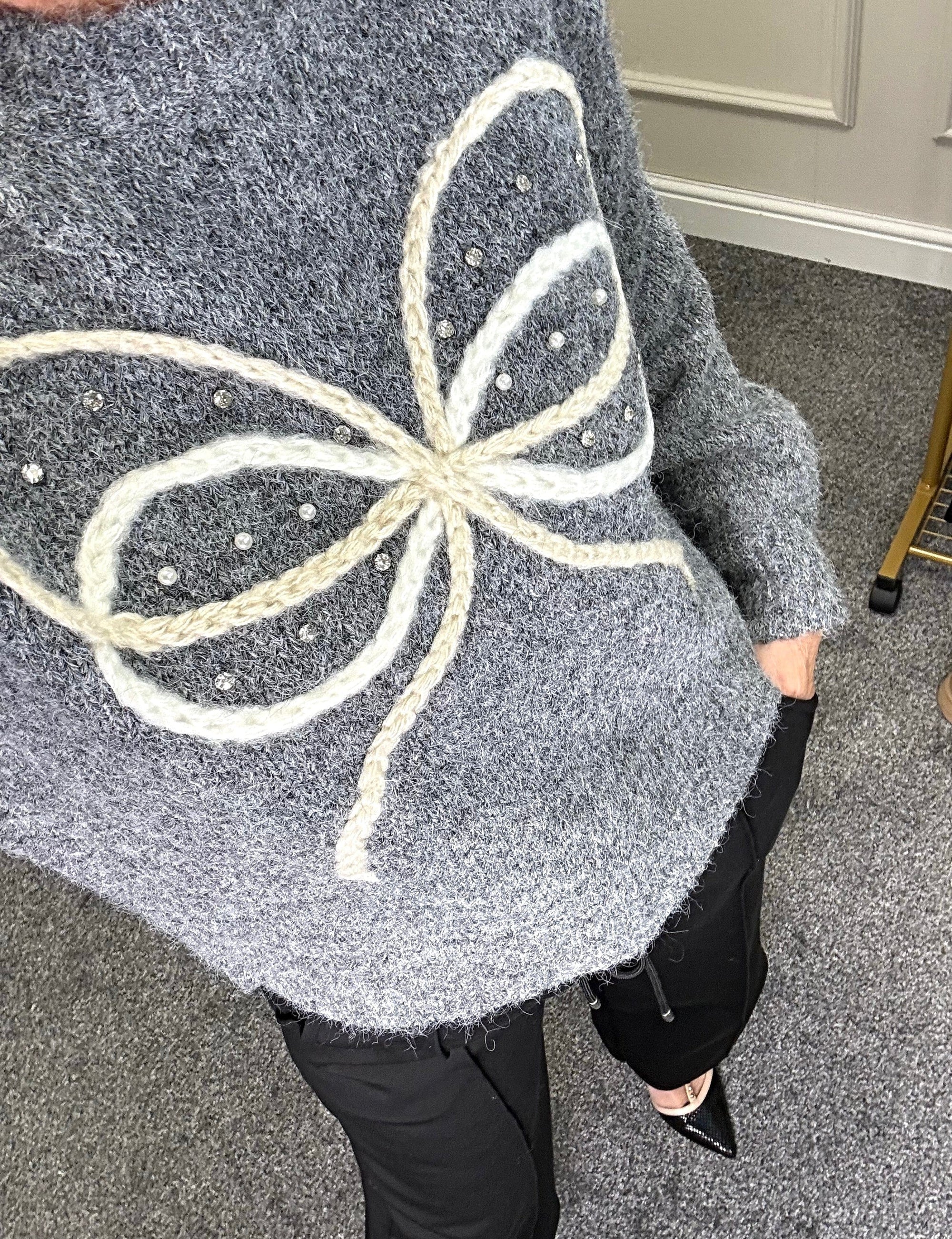 Model wearing bow and gem jumper in grey available at www.susiesboutique.co.uk