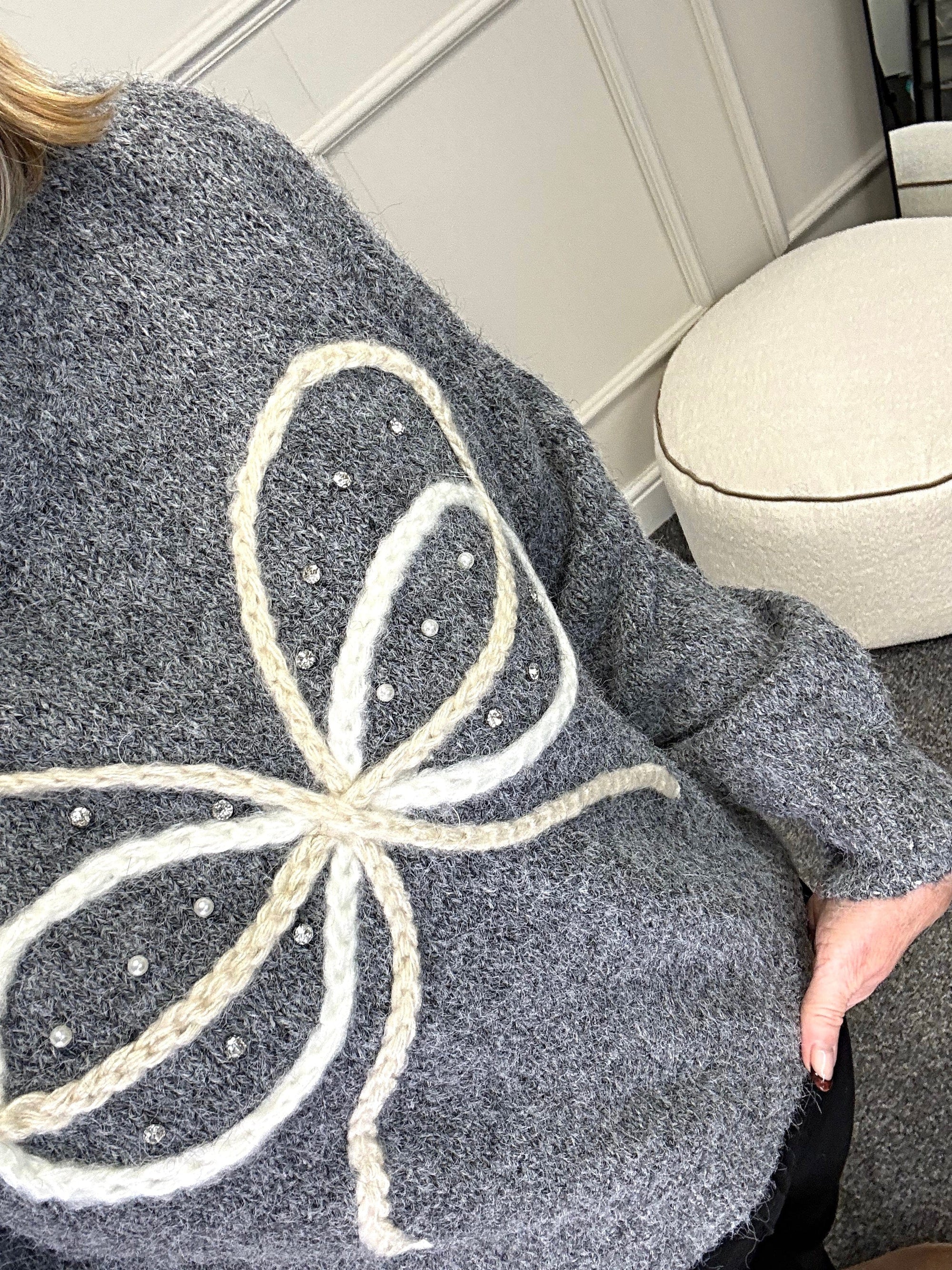 Model wearing bow and gem jumper in grey available at www.susiesboutique.co.uk