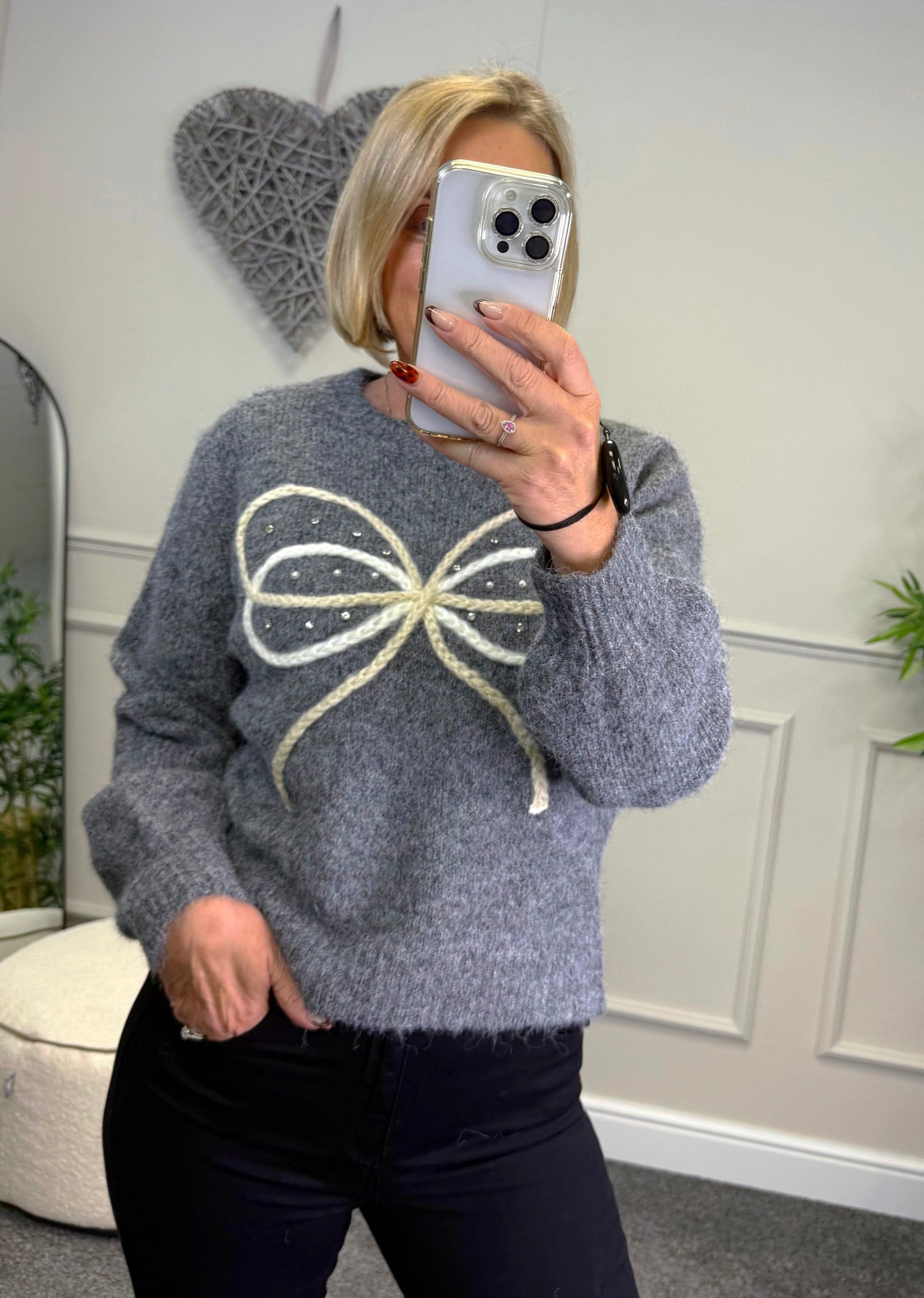 Model wearing bow and gem jumper in grey available at www.susiesboutique.co.uk