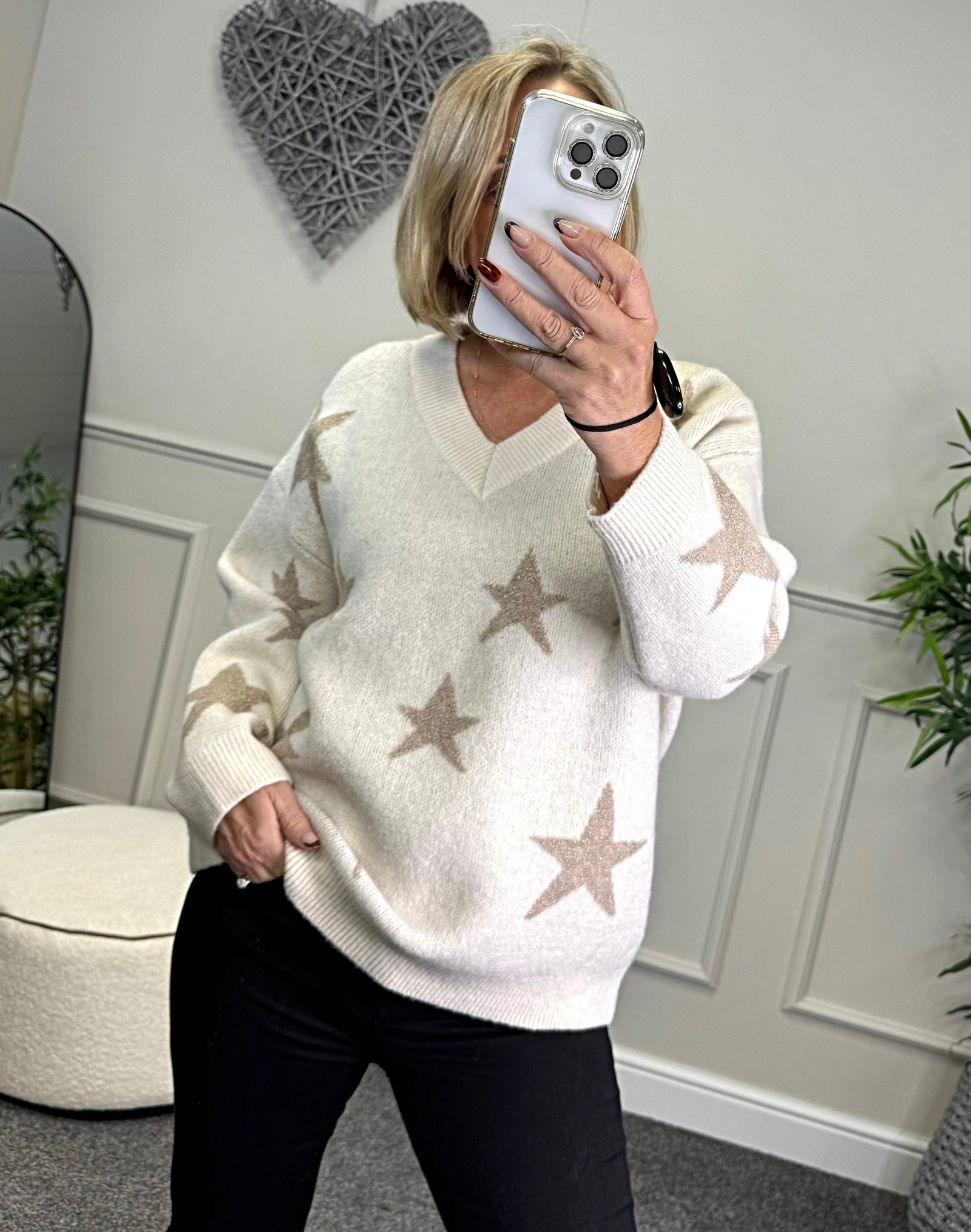 Model wearing lurex star v-neck jumper available at www.susiesboutique.co.uk