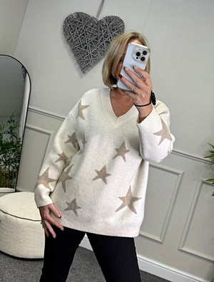 Model wearing lurex star v-neck jumper available at www.susiesboutique.co.uk