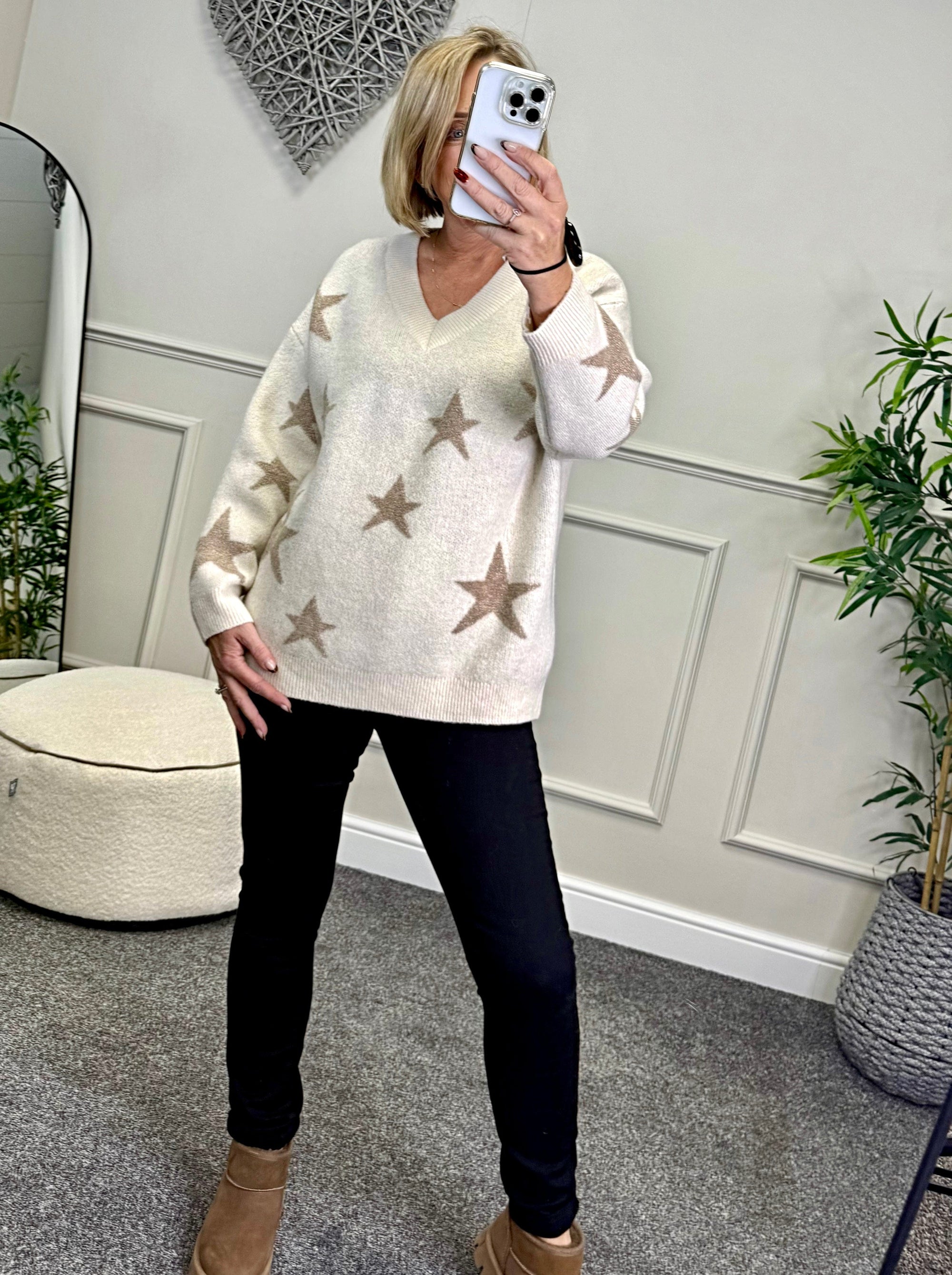 Model wearing lurex star v-neck jumper available at www.susiesboutique.co.uk