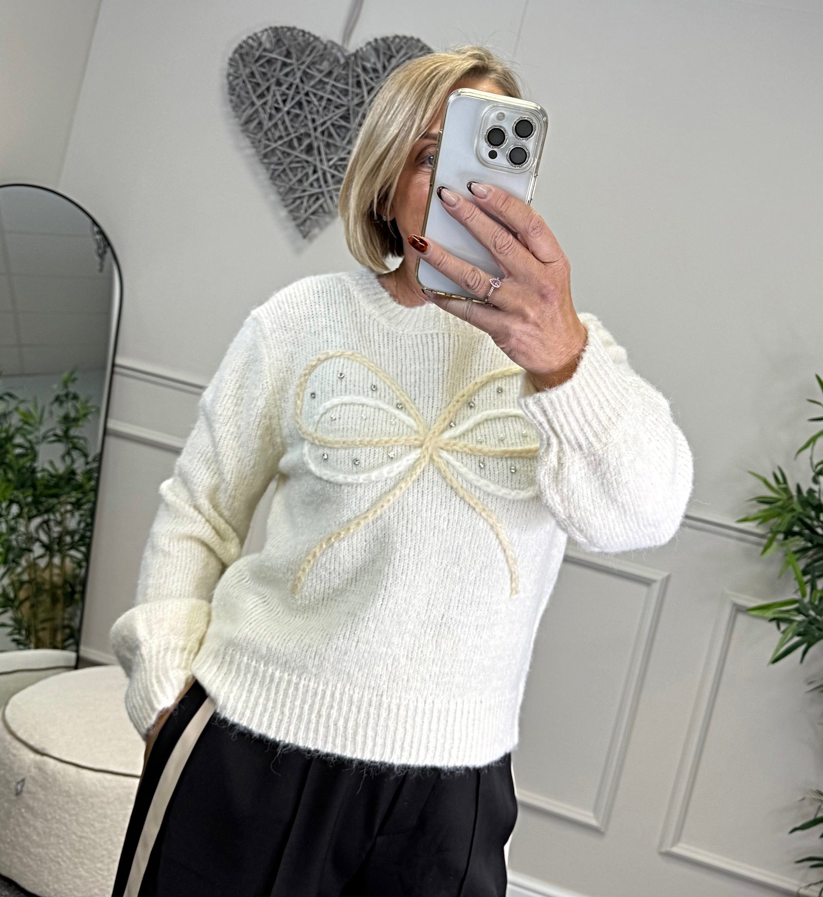 Model wearing bow and gem jumper in white available at www.susiesboutique.co.uk