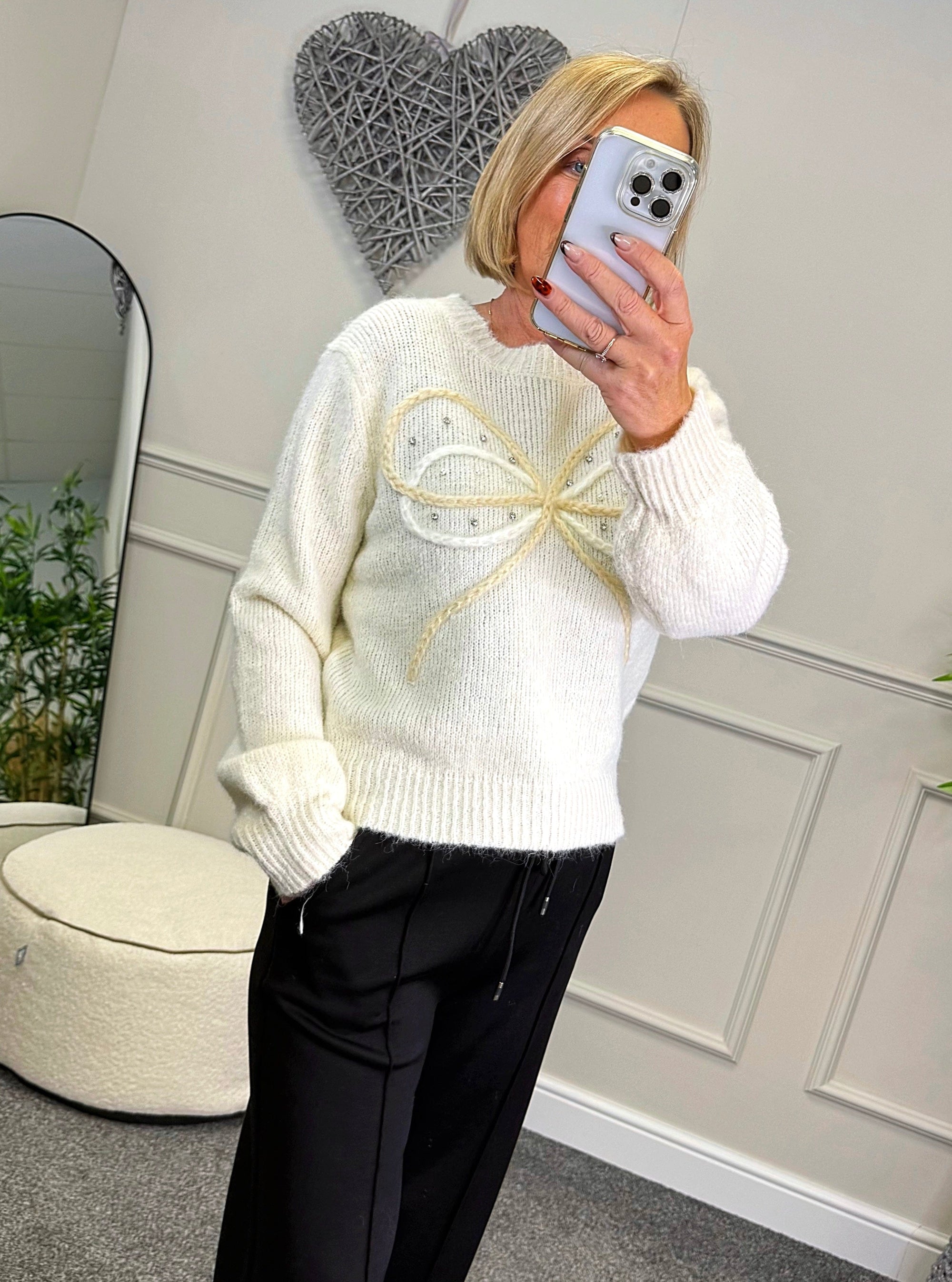Model wearing bow and gem jumper in white available at www.susiesboutique.co.uk