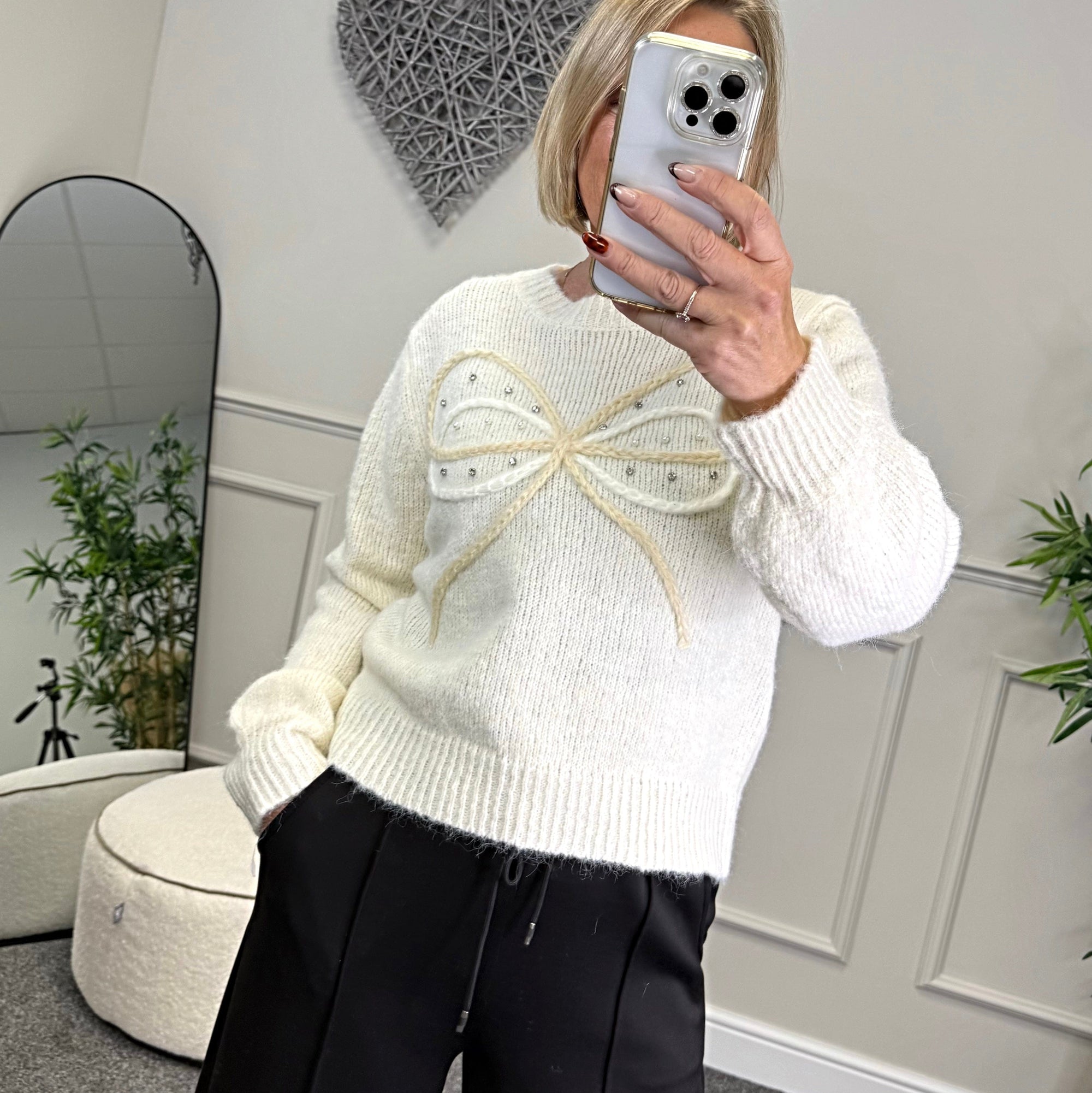 Model wearing bow and gem jumper in white available at www.susiesboutique.co.uk